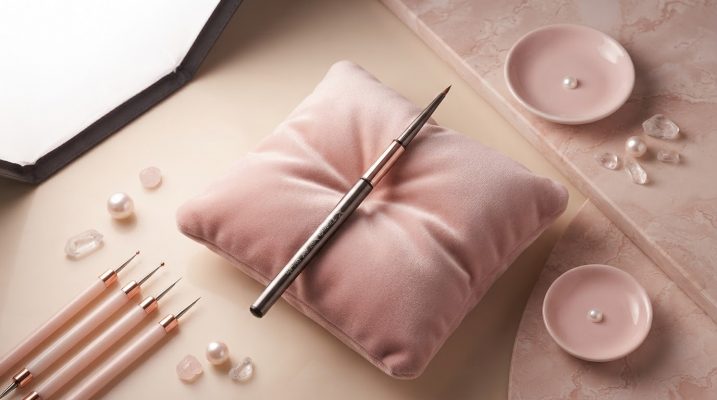 Elegant display of premium nail tools including a Kolinsky nail brush.