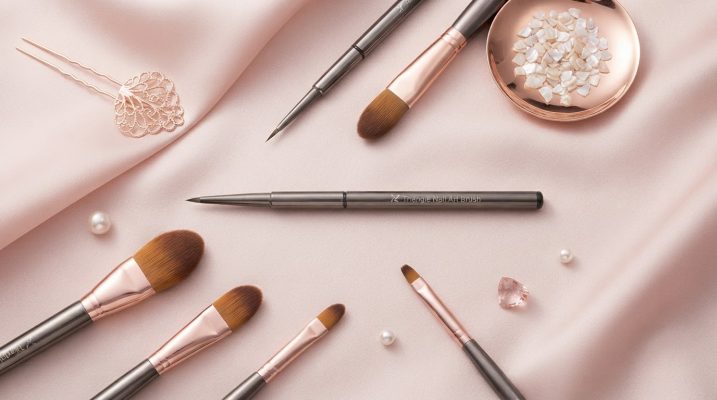 Luxury flat-lay of essential brushes for acrylic nails, featuring a Kolinsky sable brush.